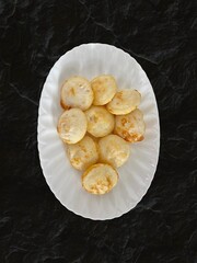 guliyappas or Poddu/Guntaponganaalu being served for breakfast in a plate