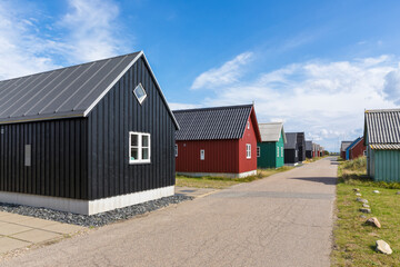 Fototapeta na wymiar Former Fishermen's huts converted to holiday homes at Hvide Sande, Denmark