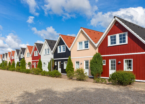 Row Of Wooden Holiday Cottages In Denmark