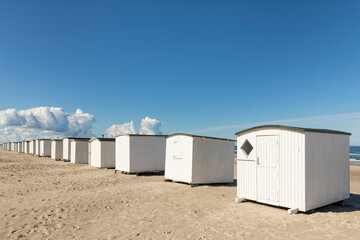 Fototapeta na wymiar Beach huts at the beach of Blokhus, North Jutland, Denmark