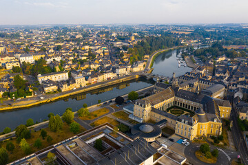 Flight over the city Chateau-Gontier Mayenne river on summer day. France