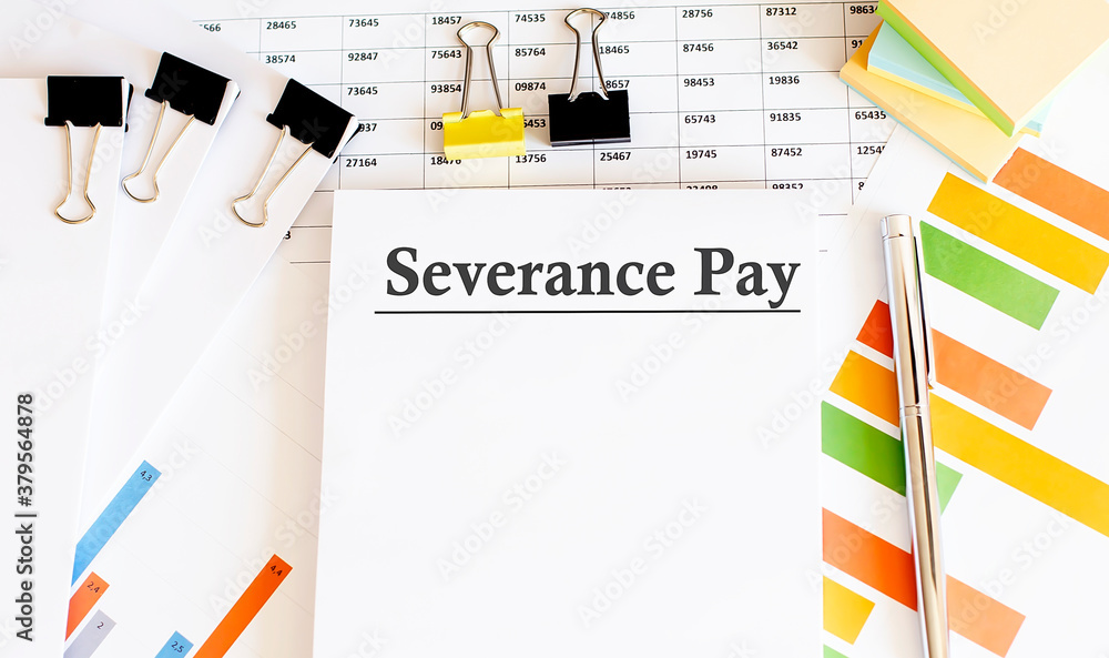 Aufkleber paper with severance pay on a table with chart