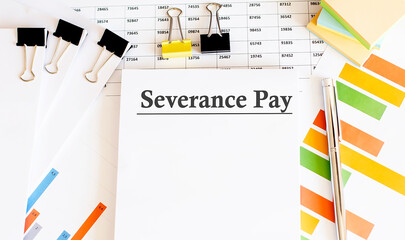 Paper with Severance Pay on a table with chart