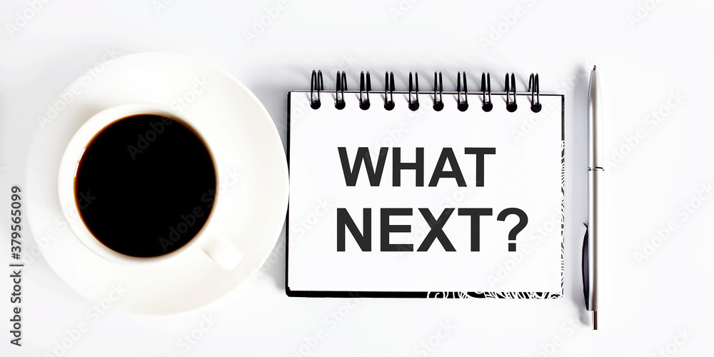 Poster text what next , planning concept. notebook with text on white background with coffee