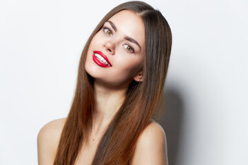 Woman with long hair tilted her head to the side and smile lipstick