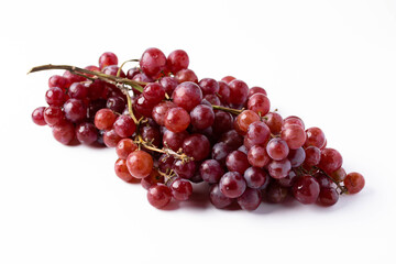 Red seedless grapes on a white background