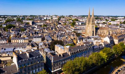 Drone view of summer cityscape of Quimper on Odet river with Gothic Roman Catholic cathedral,...