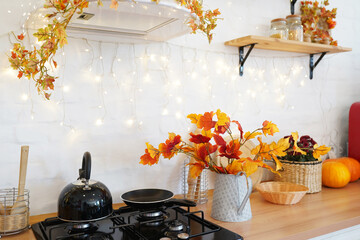 Autumn kitchen interior with pumpkin, fallen leaves, Thanksgiving dinner preparation