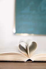 Turned pages of love shape