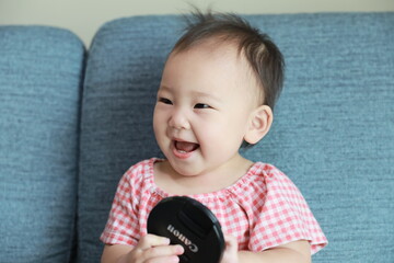little child playing with a toy