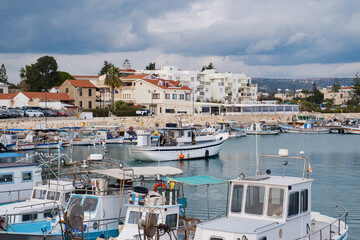 Old fishing boats in the Mediterranean sea harbor of fishing village Zygi on Cyprus island