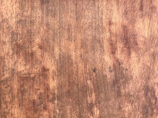 Dark brown unpainted hardwood table surface.