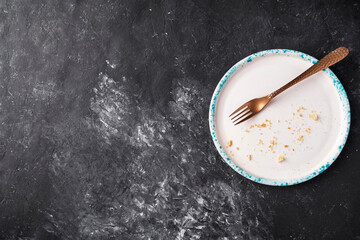 Copy space with empty dirty plate and crumbs. Top view