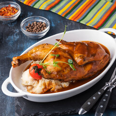 Baked chicken with mashed potatoes.