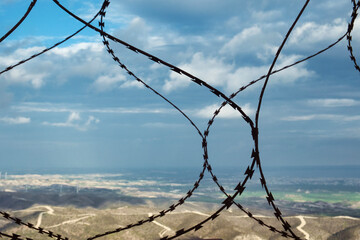 Travelling is forbidden - the security barbed barrier as a symbol of curfew and quarantine