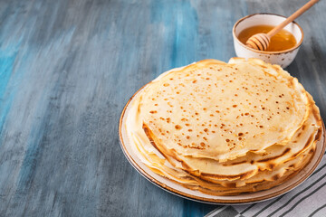 Delicious thin pancakes with honey.  Space for text