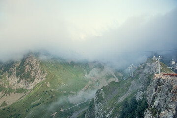 Landscape with mountains and clouds. Bird's eye view. Early, Sunny morning. Sochi. Krasnaya...