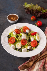 Fresh vegetables salad on a plate. Healthy food concept.
