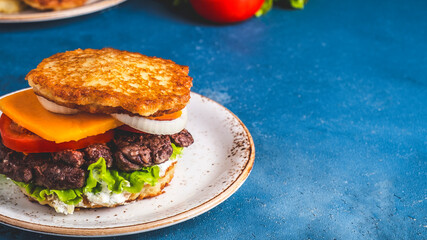 Dranburger. Potato pancakes burger with meat. Space for text