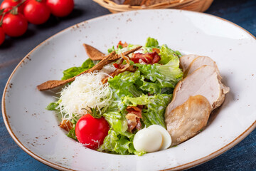 Caesar salad with fried chicken. Closeup