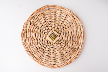 Round braided tray on white background. Top view