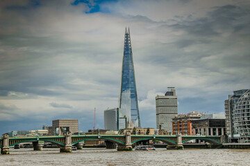 Panoramic shot of the Shard on the city of London on a cloudy day background