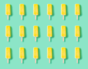 seamless yellow popsicle on a light green background