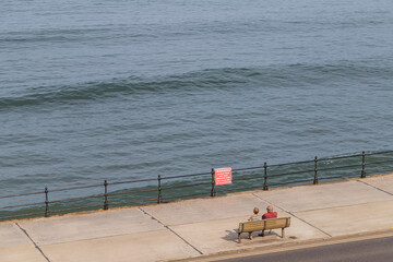 Looking down on a couple on the Scarborough promenade