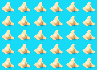 top view lots of mango flavor ice cream balls in a melting process on blue background