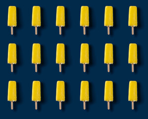 seamless yellow popsicle on a dark blue background