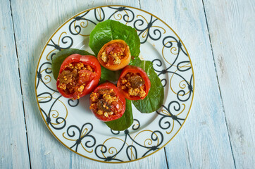 Mushroom, minced meat, tomato stuffed baked peppers