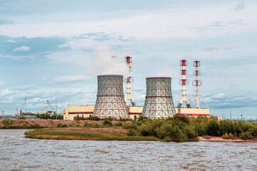 Fototapeta premium Chimneys of a power plant, an industrial district in the South-West of Saint Petersburg
