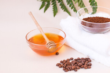 Spa care at home. Scrub of coffee and honey. Light background. Space for text. Horizontal photo. The view from the top.