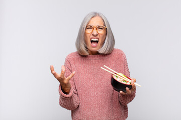 middle age woman looking angry, annoyed and frustrated screaming wtf or what‚Äôs wrong with you...