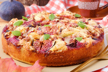 A cake with figs, walnuts and cheese. Autumn still life horizontal composition