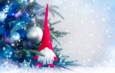 Christmas gnome under the holiday tree