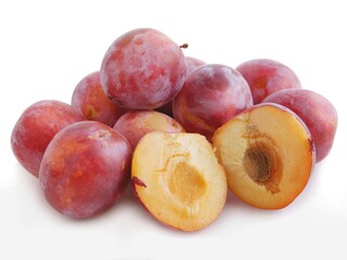 lila and pink delicious raw plums close up