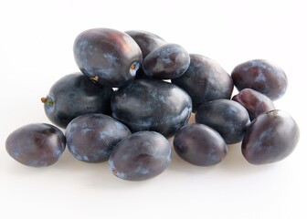 lila and pink delicious raw plums close up