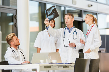 Lecturer or senior physician analyzes an X-ray image