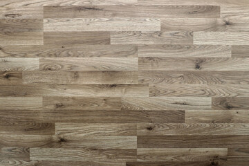 Dark gray-brown wooden laminate for abstract wooden backgrounds and textures. Wood horizontal panels with knots.
