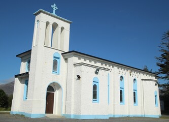 St Patrick's Church, Recess, County Galway, Ireland against backdrop of blue sky.