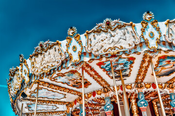PARIS, FRANCE- JULY 09, 2016 : Entertainment Carousel for the youngest children. Horses on a...