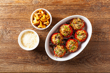 Baked stuffed tomatoes. Stuffed with chanterelles. Top view of the dish.