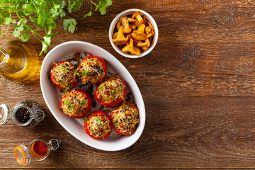 Baked stuffed tomatoes. Stuffed with chanterelles. Top view of the dish.