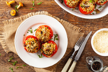Baked stuffed tomatoes. Stuffed with chanterelles. Top view of the dish.
