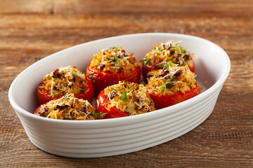 Baked stuffed tomatoes. Stuffed with chanterelles. Top view of the dish.
