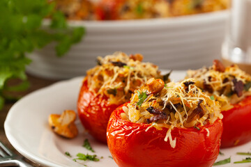 Baked stuffed tomatoes. Stuffed with chanterelles. Top view of the dish.