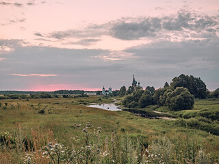 church by the river. summer landscape in the  village