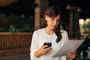 Wearing white shirt, casually dressed.