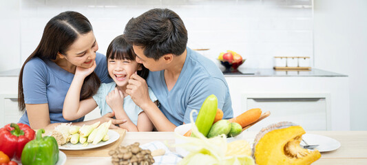 Asian family enjoy playing and cooking food in kitchen at home - 379593452